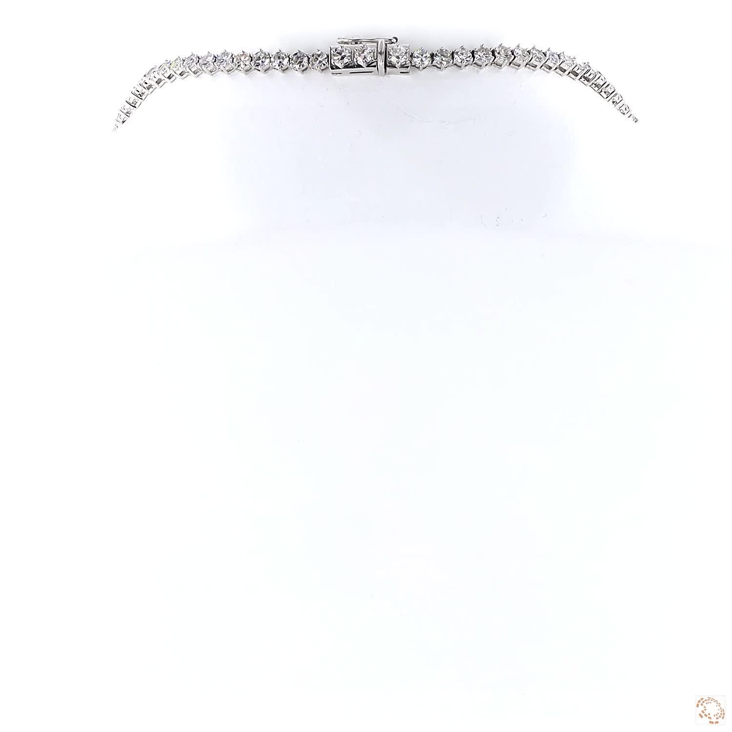 49.40 carat lab grown diamond necklace in 14KT white gold, shown with a scale reference