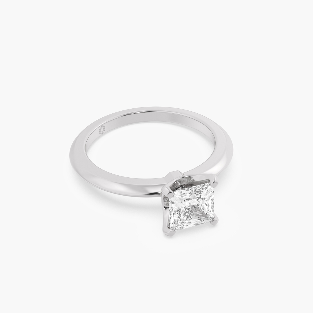 1.03 carat lab grown diamond solitaire ring in 18KT white gold, shown with a scale reference