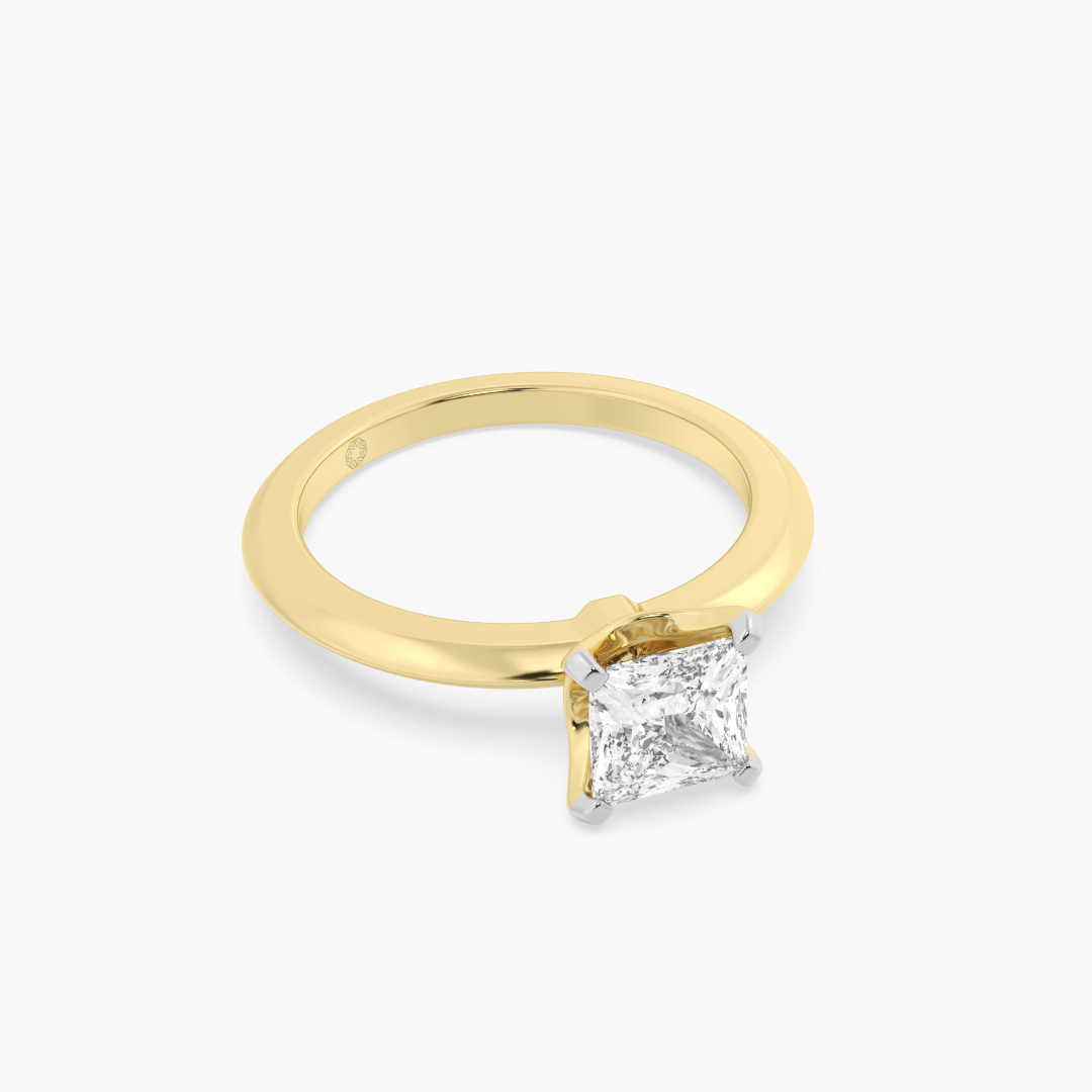 1.05 carat lab grown diamond solitaire ring in 18KT yellow gold, shown with a scale reference